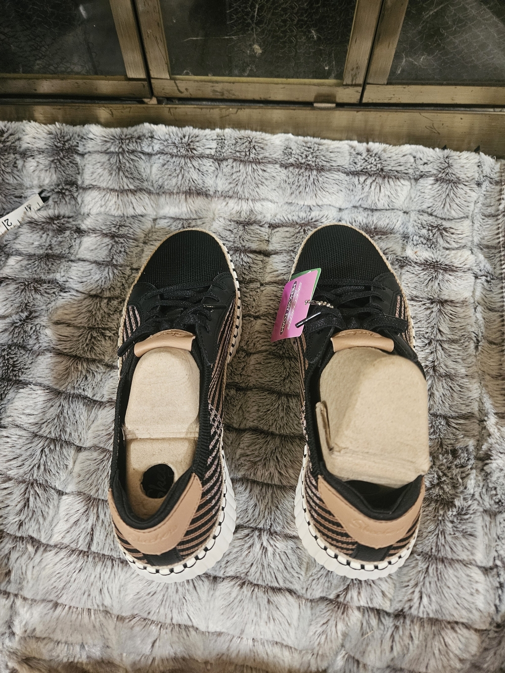 Women's Skechers Black and Tan Knit Slip-On Sneakers